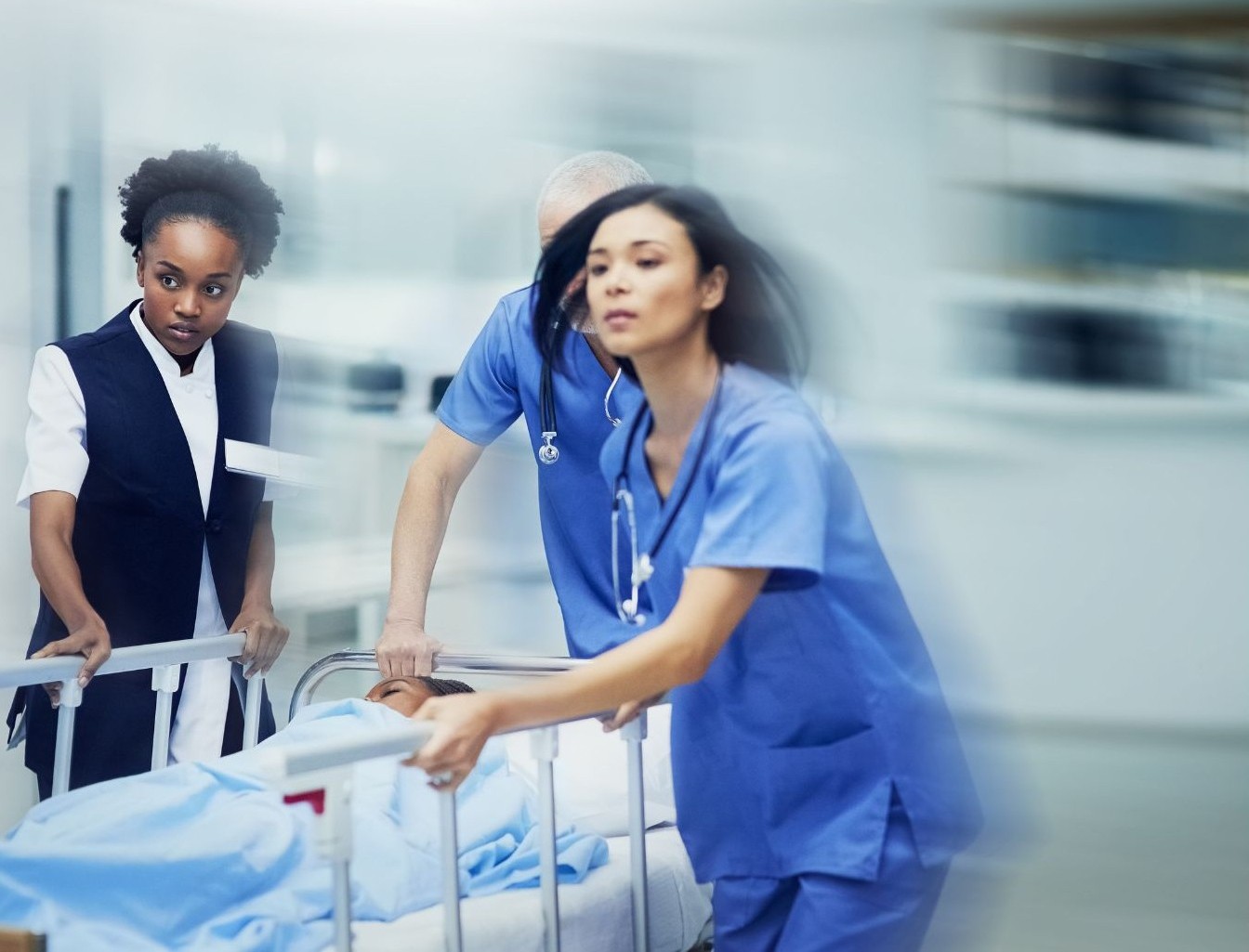 Emergency room nurses rushing with patient